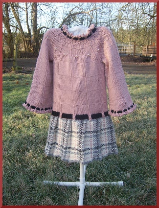 Heirloom knitted cashmere dress for a little girl.